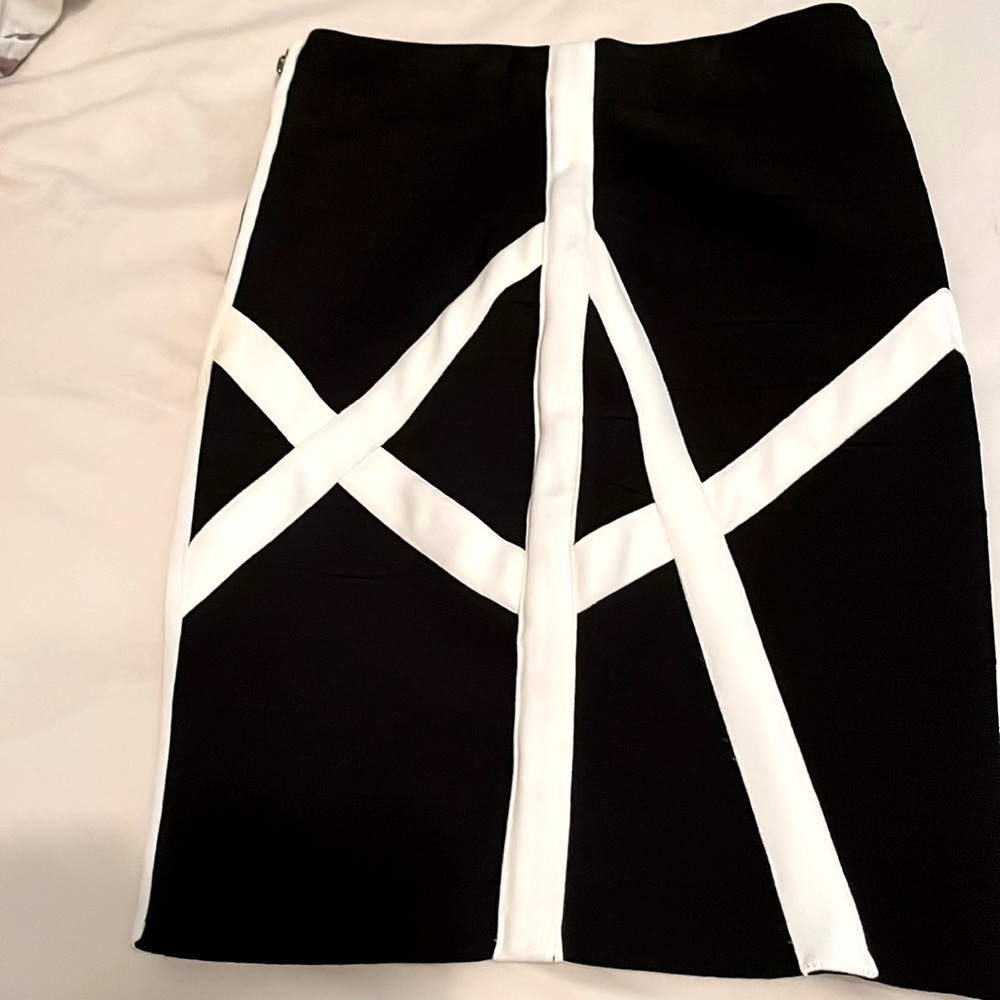 Please see label for material. Super fitted skirt. No refunds . Final sale